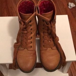Light brown girl’s combat-like boots